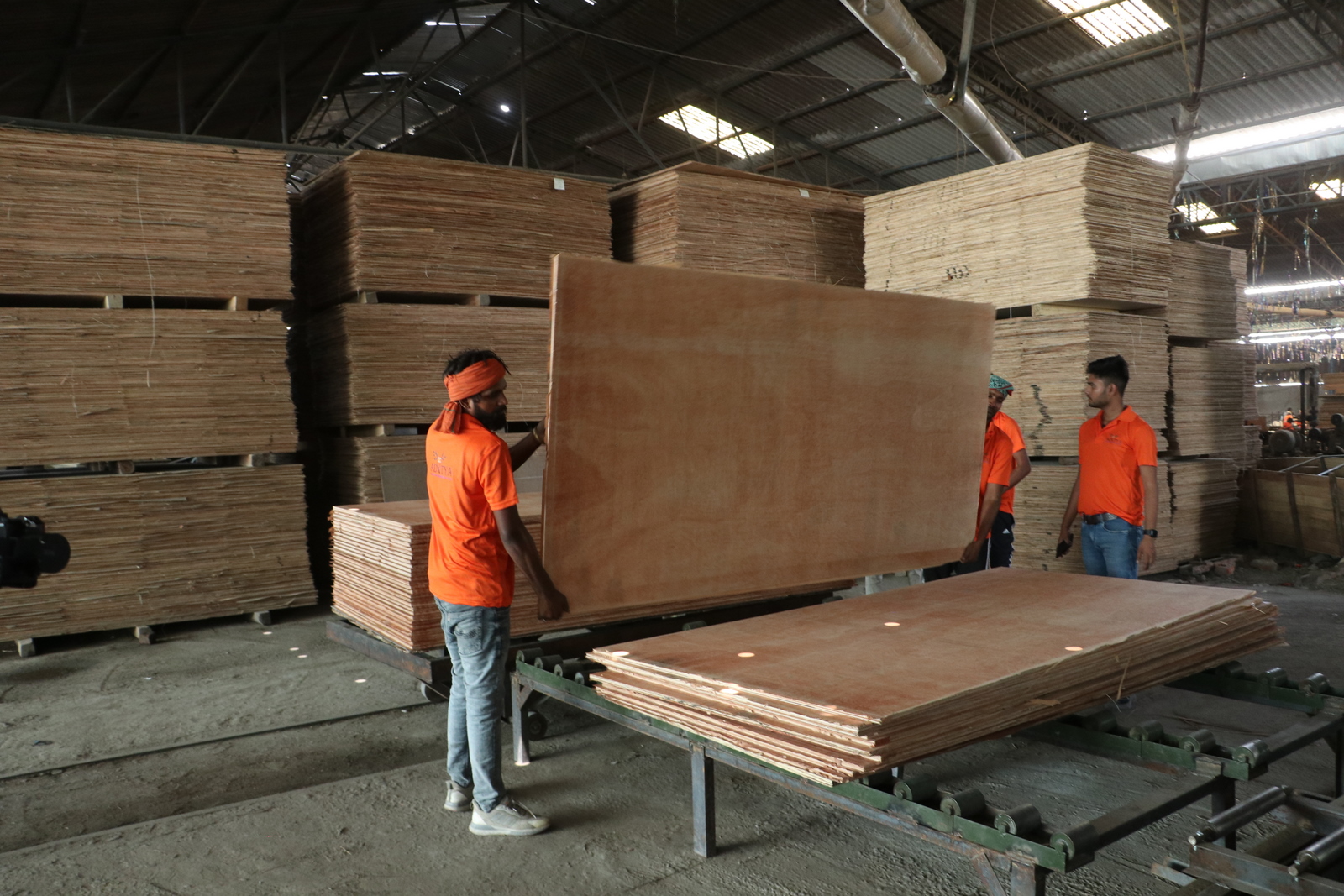 White sign with black triangle logo hanging outside a building