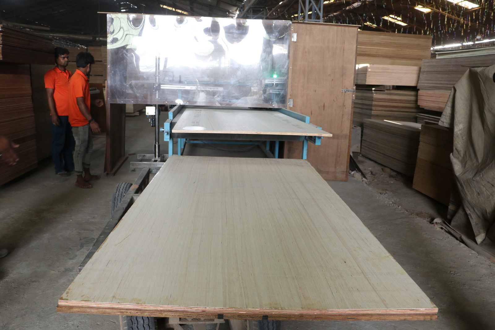White sign with black triangle logo hanging outside a building